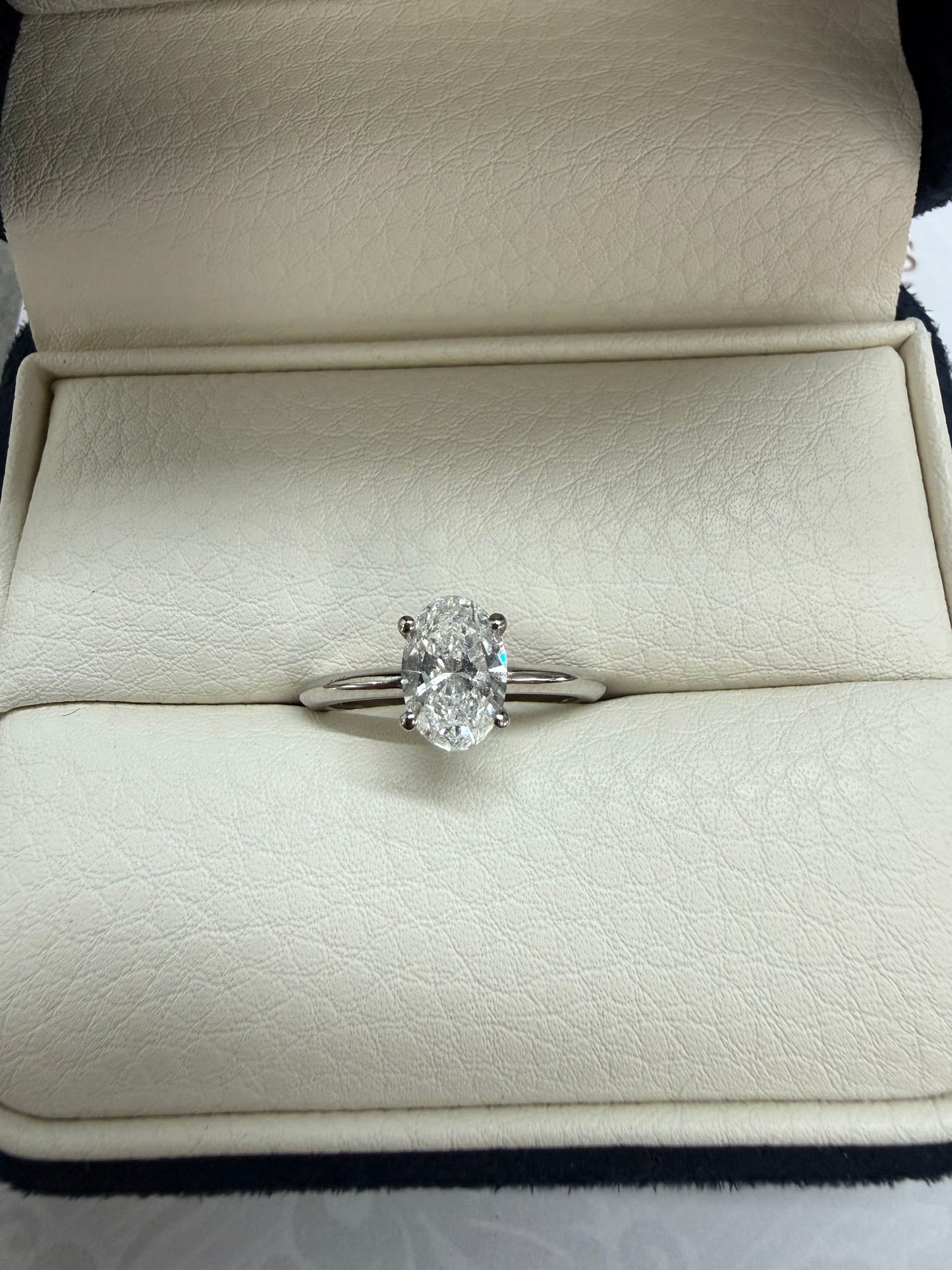 1ct Lg Oval Diamond Platinum Engagement ring with a hidden halo