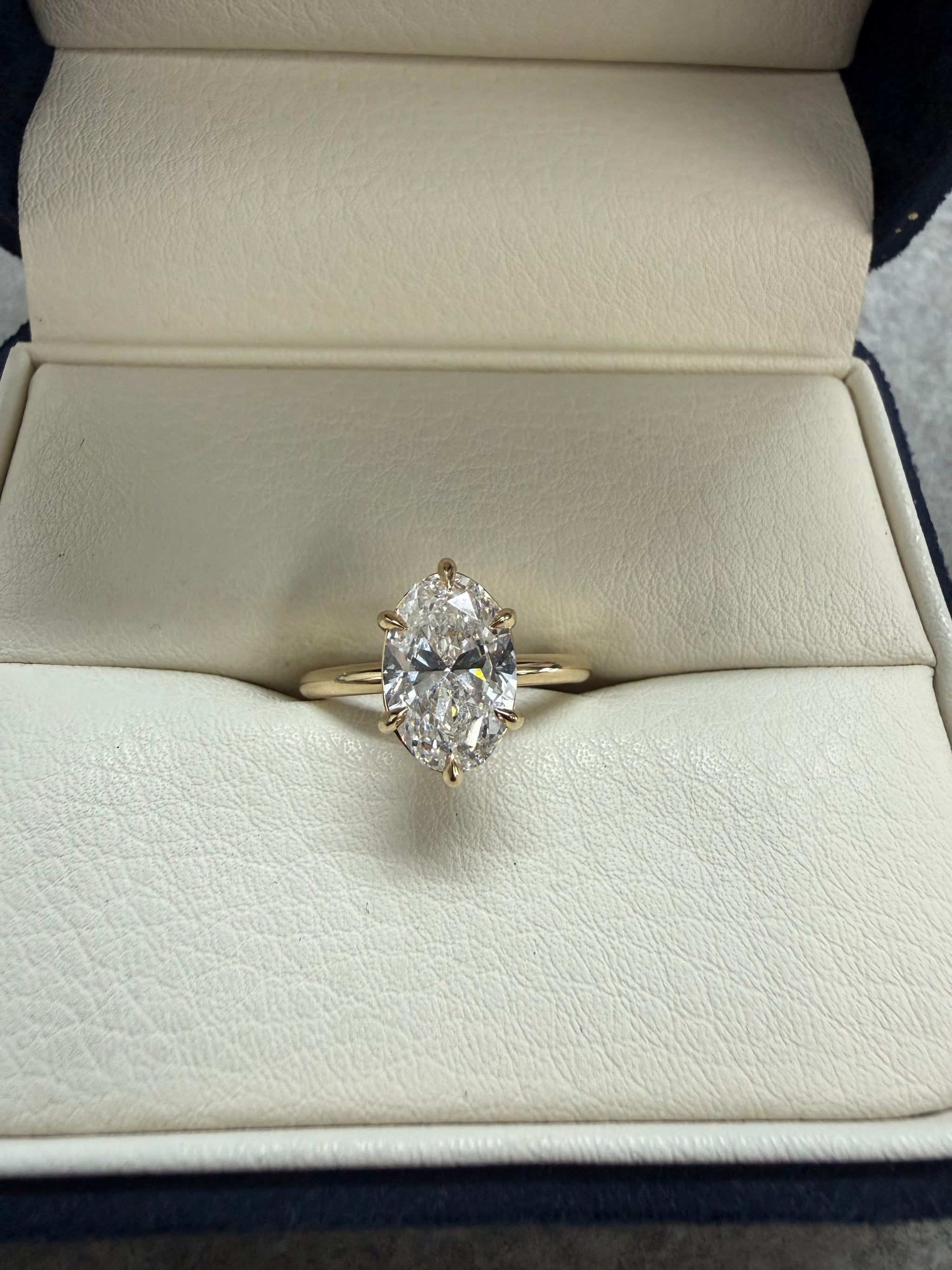 1.5ct D/Vs1 Lg Oval Diamond 6 claw engagement ring 18ct yellow gold